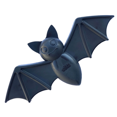 Brinquedo morcego preto de plástico com asas e inscripción made in USA.