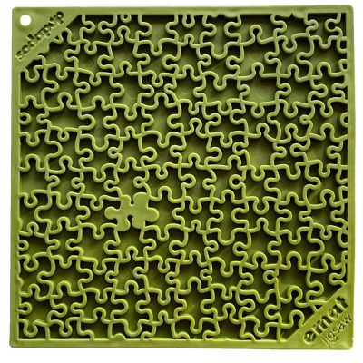 Peça de puzzle quadrado verde oliva com recortes irregulares e texto 'ecosign®' e 'artnet 1984' nos cantos