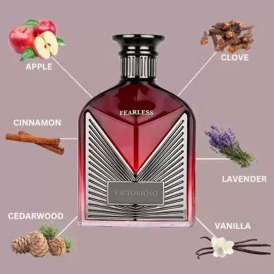 Frasco de perfume vermelho com tampa preta e etiqueta VICTORIOSO rodeado por notas de maçã, cravo, canela, lavanda, cedro e baunilha