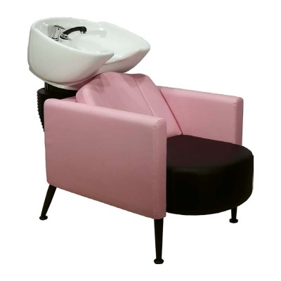 Cadeira de cabeleireiro cor-de-rosa com lava cabeça branco