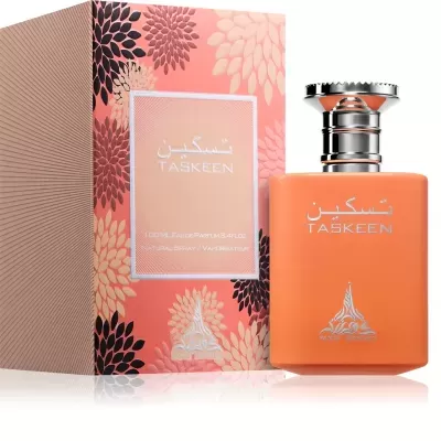 Frasco de perfume laranja mate com caixa floral e texto TASKEEN