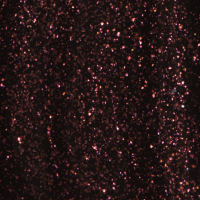 Superfície preta com brilho cintilante rosa, roxo e cobre