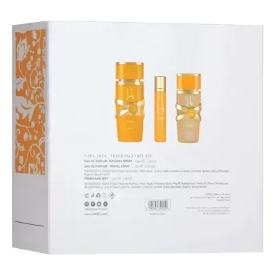 Caixa branca com conjunto de perfumes YARA TOUS em laranja e bege com detalhes dourados