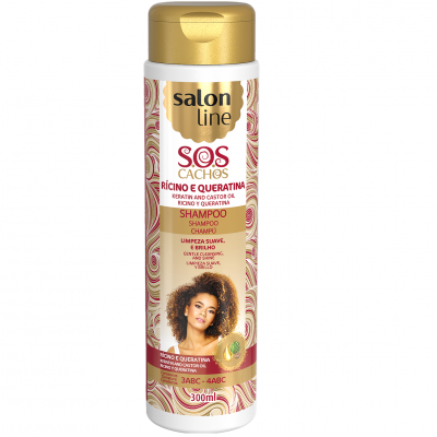 Frasco branco e dourado de champô Salon Line SOS Cachos com padrão dourado e imagem de mulher com cabelo cacheado.