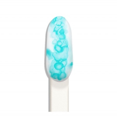 Amostra oval de cor turquesa e branco numa base branca