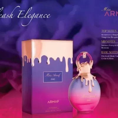 Frasco e caixa do perfume Miss Armaf Chic em tons roxo e rosa com detalhes dourados e texto Unleash Elegance