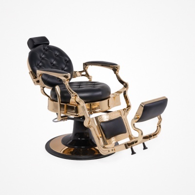 Cadeira de barbeiro preta e dourada com estofos acolchoados