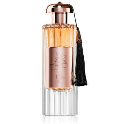 Frasco de perfume transparente com tampa rosé e franjas pretas