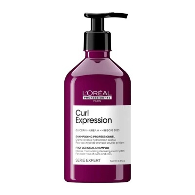 Frasco roxo de champô L'Oréal Professionnel Curl Expression com doseador preto e etiqueta branca.