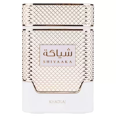 Frasco de perfume dourado e branco com textos SHIYAAKA e KHADLAJ