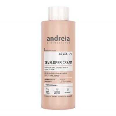 Frasco cor de rosa claro com tampa branca do creme desenvolvedor Andreia Professional