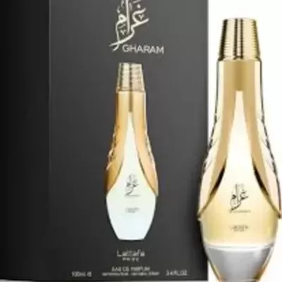 Frasco e caixa de perfume dourado Gharam da Lattafa