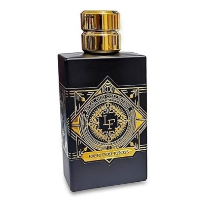 Frasco preto de perfume com tampa e detalhes dourados, texto decorativo visível.