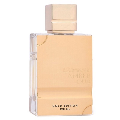 Frasco de perfume dourado e transparente com texto HARMAINI AMBER OUD e GOLD EDITION 120 ML