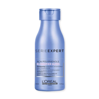 Frasco azul metálico de shampoo L'Oréal Serie Expert Blondifier Gloss