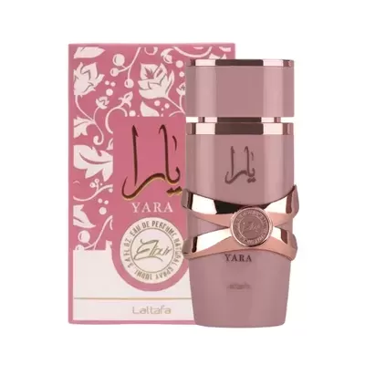 Frasco de perfume rosa mauve com detalhes dourados e caixa rosa com padrão floral branco