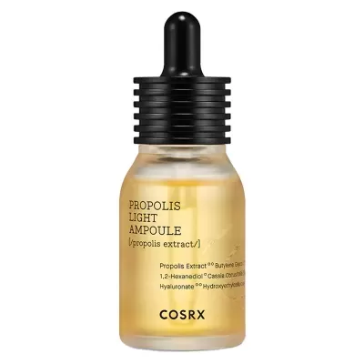 Frasco de serúm COSRX com conta-gotas e líquido amarelo