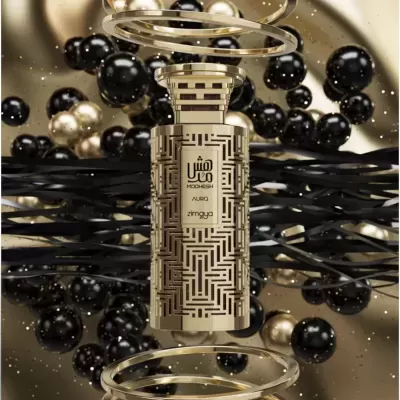 Frasco de perfume dourado com padrão geométrico e texto MOOHESH AURA zimaya