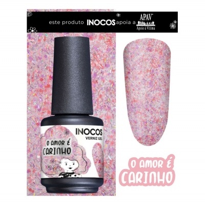 Verniz gel INOCOS rosa com textura brilhante e rótulo com texto 'O AMOR É CARINHO'.