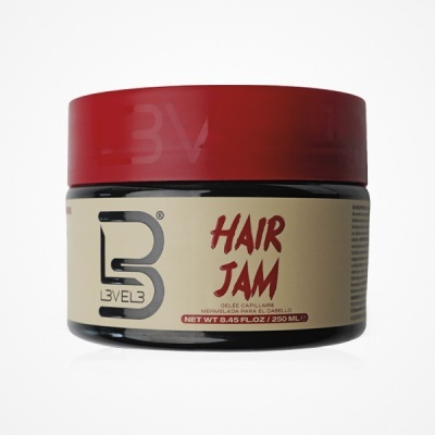 Frasco redondo de gel para cabelo com tampa vermelha e rótulo creme e preto
