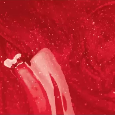 textura líquida vermelha brilhante com partículas metálicas