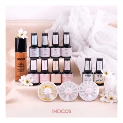 Conjunto de produtos de manicure INOCOS com vernizes, brilho, top e base gel, e decorações de unhas