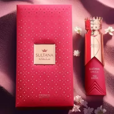 Perfume SULTANA com frasco vermelho e tampa dourada em forma de coroa junto a caixa vermelha decorada