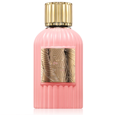 Frasco de perfume rosa com tampa dourada e placa decorativa dourada