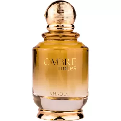 Frasco de perfume âmbar com tampa dourada e texto OMBRE notes KHADLAJ