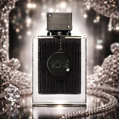 Frasco de perfume ARMAF BLING em fundo brilhante e metálico