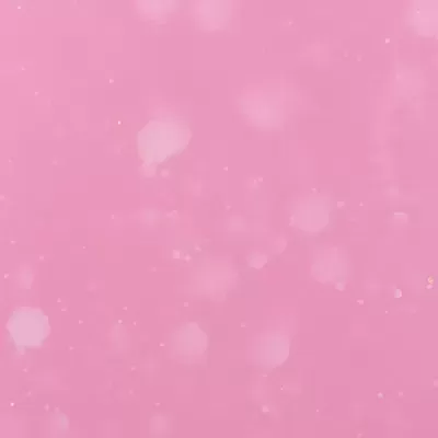 Fundo rosa com efeito bokeh e partículas brilhantes