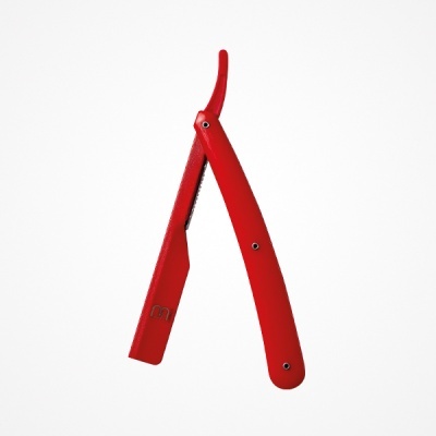 Navaja de afeitar vermelha com lâmina exposta