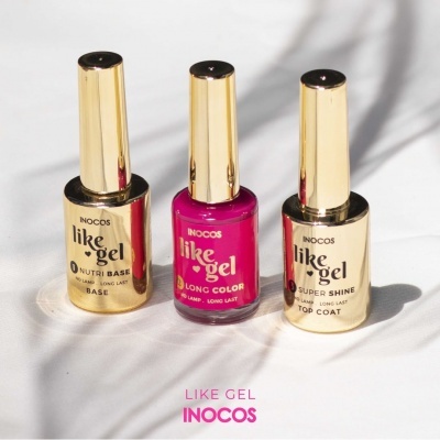 Três frascos de verniz de unhas dourados e rosa da marca INOCOS
