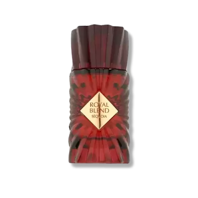 Frasco vermelho translúcido facetado com rótulo dourado de perfume Royal Blend Sequoia