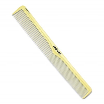 Pente amarelo de plástico com a marca JAGUAR