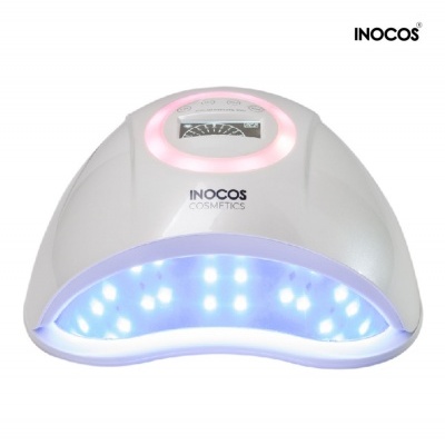 Secador de unhas UV/LED branco da INOCOS Cosmetics com luzes acesas
