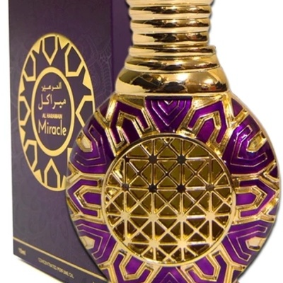 Frasco de perfume roxo e dourado com caixa roxa Al Haramain Miracle