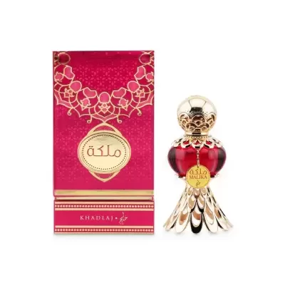 Frasco de perfume e embalagem cor de rosa com detalhes dourados