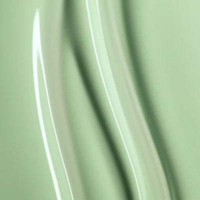 Superfície verde claro lisa e brilhante em close-up