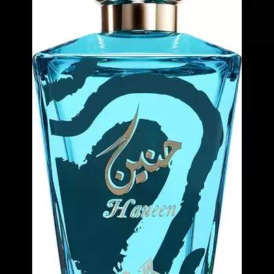 frasco de perfume azul translúcido com tampa transparente e texto dourado