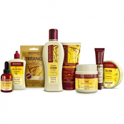 Conjunto de produtos Bio Extratus para cuidados capilares com embalagens amarelas e vermelhas