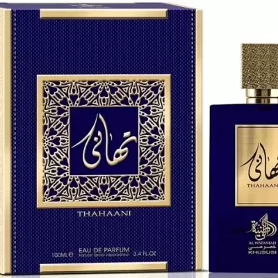Frasco e embalagem de perfume azul e dourado com texto em árabe e THAHAANI
