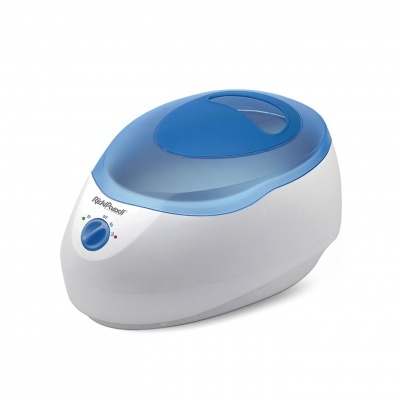 aparelho de cera eléctrica branco com tampa azul translúcida e botão azul frontal