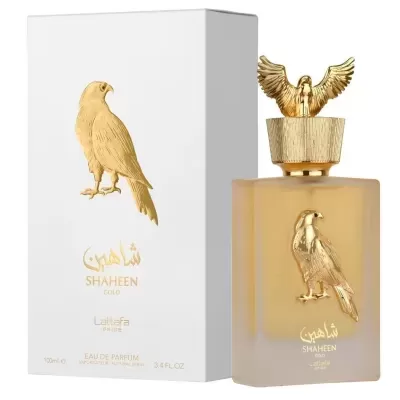 Frasco de perfume Shaheen Gold com figura dourada de falcão e caixa branca