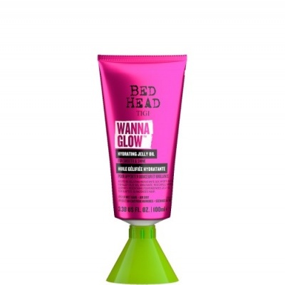 Tubo plástico cor de rosa com tampa verde de produto de beleza WANNA GLOW