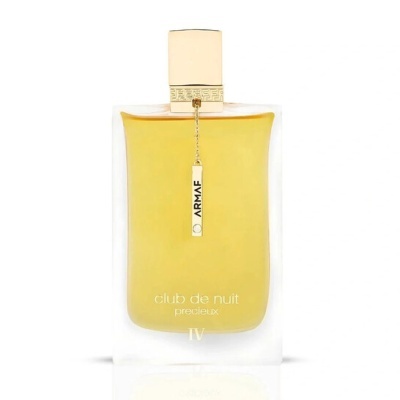 Frasco de perfume transparente com líquido amarelo e tampa dourada