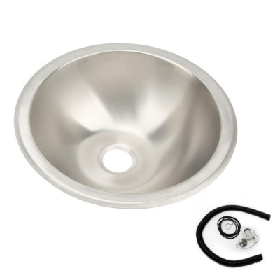 Tigela metálica redonda prateada com acessórios pretos ao lado