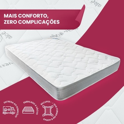 Colchão branco com padrões sobre fundo cor de vinho e texto promocional