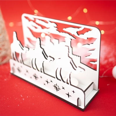 Suporte acrílico branco com recortes em fundo vermelho com luzes desfocadas