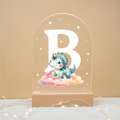 Lâmpada decorativa com base em madeira e ecrã acrílico com dinossauro azul e letra B